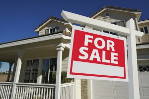 Sold Home For Sale Sign & New House